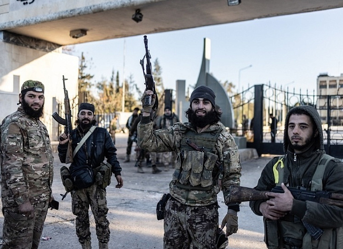 Syria announces imminent disbanding of militant groups that overthrew Assad